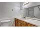 This bathroom offers a vanity with sink, a toilet and shower at 5990 Mallory Rd, South Fulton, GA 30349