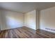 This living room has light walls, wood-look floors and baseboard heater at 5990 Mallory Rd, South Fulton, GA 30349