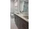 Updated bathroom features double vanity, marble countertop, and tiled shower with glass door at 3996 Spalding Ln, Atlanta, GA 30350