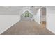 Spacious bonus room with neutral carpet and skylights that brighten the room with natural light at 3996 Spalding Ln, Atlanta, GA 30350