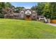 Elegant two-story brick home with a manicured lawn and inviting front entrance at 3996 Spalding Ln, Atlanta, GA 30350