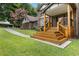 Welcoming front porch with wooden steps, brick pillars, and a cozy covered entrance to the home at 3996 Spalding Ln, Atlanta, GA 30350