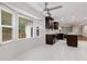 A modern eat-in kitchen features white tile flooring and dark cabinetry with a stainless steel ceiling fan at 3996 Spalding Ln, Atlanta, GA 30350