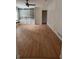 Spacious living room with hardwood floors, custom built-in shelving and paneled walls, offering ample storage at 3996 Spalding Ln, Atlanta, GA 30350