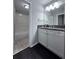 Bathroom featuring a tub shower and white vanity with dark countertop at 4244 River Green Nw Dr # 111, Atlanta, GA 30327