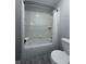 Clean bathroom featuring a tiled shower-over-tub and modern toilet at 4244 River Green Nw Dr # 111, Atlanta, GA 30327