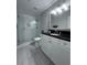 Bathroom featuring a glass shower and white vanity with dark countertop at 4244 River Green Nw Dr # 111, Atlanta, GA 30327