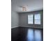 Bedroom featuring two windows and a modern light fixture at 4244 River Green Nw Dr # 111, Atlanta, GA 30327