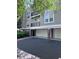 Attractive condo building featuring a private garage and welcoming curb appeal at 4244 River Green Nw Dr # 111, Atlanta, GA 30327