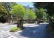 Community featuring a secure gated entrance with well-maintained landscaping and manicured grounds at 4244 River Green Nw Dr # 111, Atlanta, GA 30327