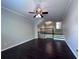Open-concept living room with gleaming hardwood floors and neutral wall colors at 4244 River Green Nw Dr # 111, Atlanta, GA 30327