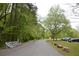 Entrance of the park features available bike rentals, parking lot, and paved walking trail at 4244 River Green Nw Dr # 111, Atlanta, GA 30327