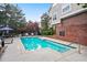 A clear community pool with patio, chairs and landscaping at 4244 River Green Nw Dr # 111, Atlanta, GA 30327