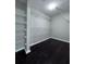 Walk-in closet featuring ample wire shelving and dark floors at 4244 River Green Nw Dr # 111, Atlanta, GA 30327