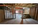 Unfinished basement space with concrete floor, exposed framework, and a workbench at 488 Morris Rd, Hiram, GA 30141