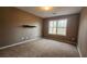 Bedroom with neutral walls and carpeting, and a single window at 488 Morris Rd, Hiram, GA 30141