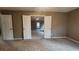 Shot of a bedroom featuring double doors leading to the main bedroom space at 488 Morris Rd, Hiram, GA 30141