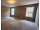Spacious bedroom illuminated by two large windows and featuring neutral carpeting at 488 Morris Rd, Hiram, GA 30141