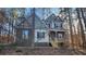 Inviting two-story home featuring stone accents and a cozy front porch at 488 Morris Rd, Hiram, GA 30141