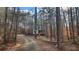 Charming two-story home nestled among trees, offering a secluded and private setting at 488 Morris Rd, Hiram, GA 30141