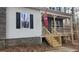 Close-up of the front porch with wood railings and stone accents at 488 Morris Rd, Hiram, GA 30141