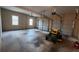 Three-door garage featuring a yard mower and natural light from two windows at 488 Morris Rd, Hiram, GA 30141
