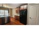 Cozy kitchen featuring granite countertops, wooden cabinets, and stainless steel dishwasher appliance at 488 Morris Rd, Hiram, GA 30141