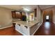 Open kitchen view features a large granite island, modern appliances, and wood flooring at 488 Morris Rd, Hiram, GA 30141