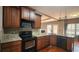 This beautiful kitchen has granite countertops and stainless steel appliances at 488 Morris Rd, Hiram, GA 30141