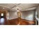 Spacious living room featuring tray ceiling detail, recessed lights, and hardwood floors at 488 Morris Rd, Hiram, GA 30141
