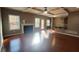 Bright open living room with fireplace, coffered ceiling, hardwood floors, and kitchen access at 488 Morris Rd, Hiram, GA 30141