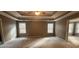 Open main bedroom with neutral color walls, carpet, and natural light at 488 Morris Rd, Hiram, GA 30141