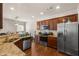 Modern kitchen with granite countertops, stainless appliances, and stylish cabinetry at 1749 Charcoal Ives Rd, Lawrenceville, GA 30045