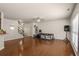 Open-concept living area with hardwood floors and neutral paint at 1749 Charcoal Ives Rd, Lawrenceville, GA 30045