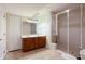 Bathroom features a double vanity, a tiled shower, tile flooring and neutral paint at 2322 Norbury Se Cv, Smyrna, GA 30080