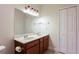 Bathroom showcasing a double vanity, large mirror, updated lighting and a linen closet at 2322 Norbury Se Cv, Smyrna, GA 30080