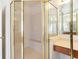 Bathroom featuring glass shower and vanity with double sinks at 2322 Norbury Se Cv, Smyrna, GA 30080