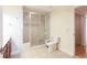 Bathroom with a glass-enclosed shower, tile flooring, and a toilet at 2322 Norbury Se Cv, Smyrna, GA 30080