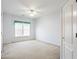 Bright bedroom featuring neutral carpet and large window at 2322 Norbury Se Cv, Smyrna, GA 30080