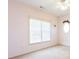 Bedroom with a large window and neutral carpet at 2322 Norbury Se Cv, Smyrna, GA 30080