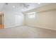 Bonus room with carpet, a ceiling fan, pot lights, closet and a window at 2322 Norbury Se Cv, Smyrna, GA 30080