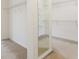 Walk-in closet with ample shelving and neutral carpet at 2322 Norbury Se Cv, Smyrna, GA 30080