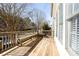 Inviting wooden deck featuring built-in bench seating and ample space for outdoor enjoyment at 2322 Norbury Se Cv, Smyrna, GA 30080