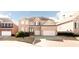 Traditional brick home with a two-car garage and well-manicured landscaping at 2322 Norbury Se Cv, Smyrna, GA 30080