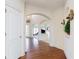 Inviting foyer with hardwood floors, arched doorways, and decorative wall accents, leading to various rooms at 2322 Norbury Se Cv, Smyrna, GA 30080
