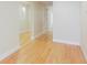 Bright hallway features wood flooring, white trim and neutral paint leading to another room at 2322 Norbury Se Cv, Smyrna, GA 30080