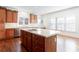 Open kitchen with a stainless steel dishwasher, island cooktop, and lots of cabinet space at 2322 Norbury Se Cv, Smyrna, GA 30080