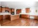 Large kitchen boasts hardwood floors, center island with cooktop, and lots of counter space at 2322 Norbury Se Cv, Smyrna, GA 30080