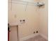 Laundry room featuring tile flooring, laundry hookups and a storage shelf at 2322 Norbury Se Cv, Smyrna, GA 30080