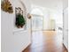 Bright and airy living room with hardwood floors, fireplace, large arched window, and white trim at 2322 Norbury Se Cv, Smyrna, GA 30080